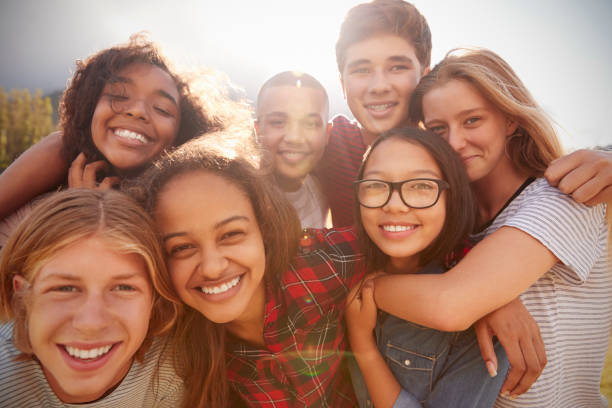 A group of smiling teens together